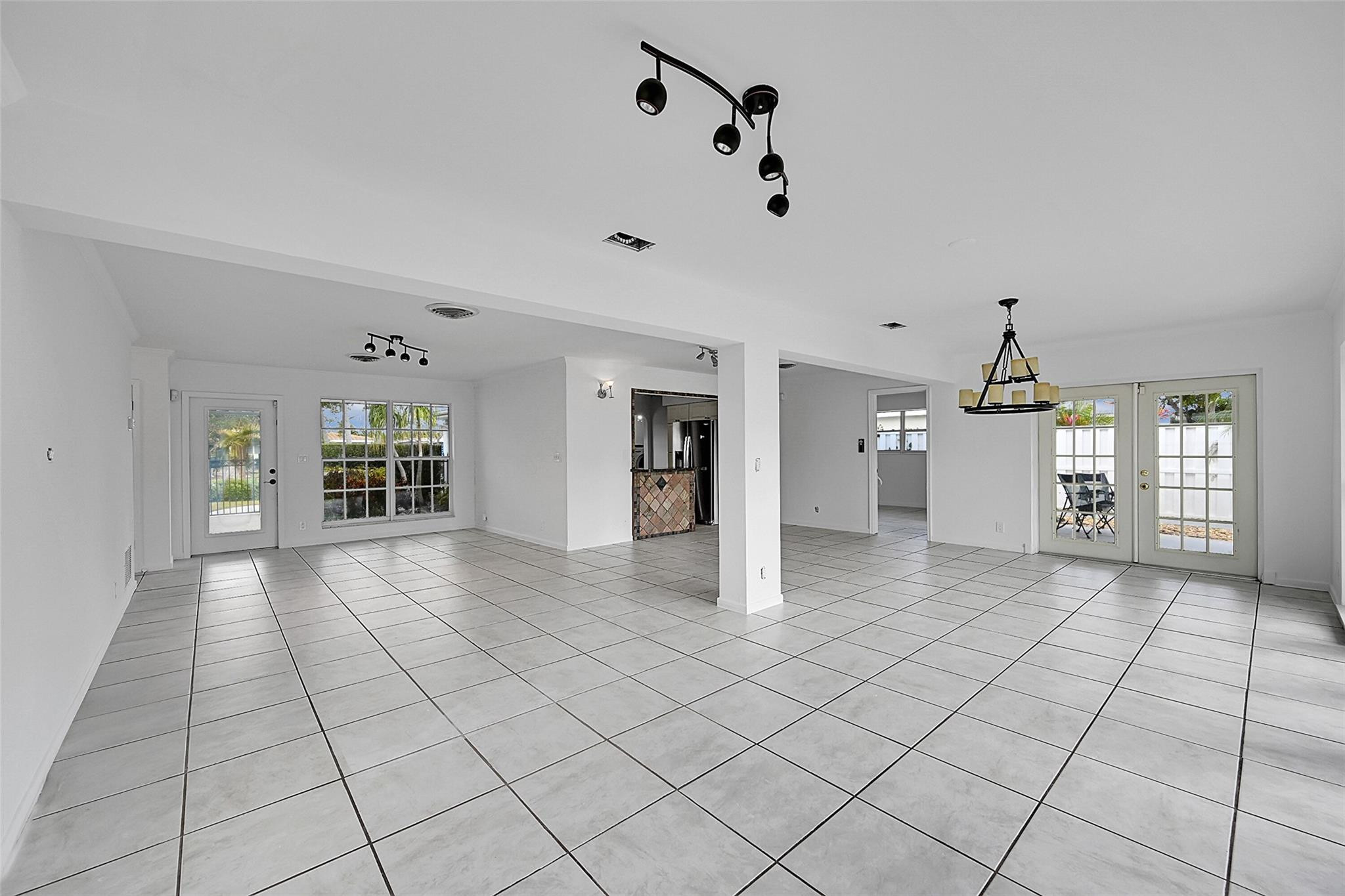 220 Southeast 10th Street Pompano Beach, FL 33060 - Photo 8 of 42 a view of an empty room with window and cabinet