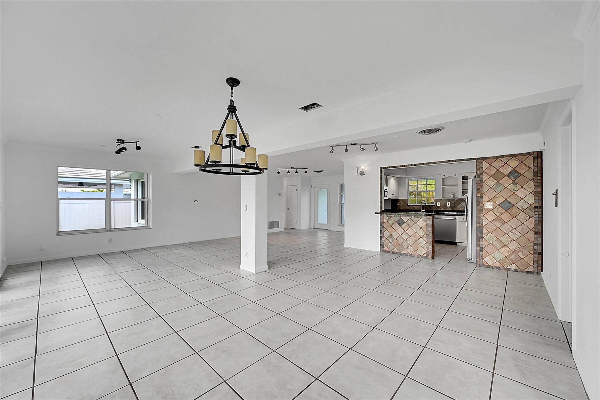 220 Southeast 10th Street Pompano Beach, FL 33060 - Photo 10 of 42 a view of a kitchen with furniture and a kitchen