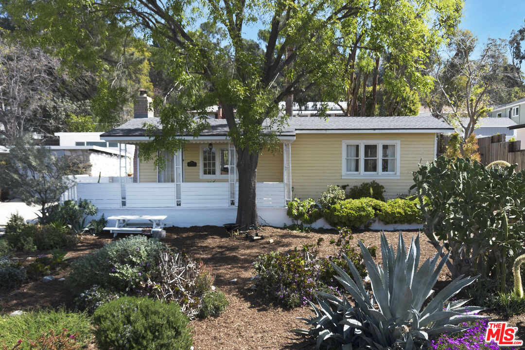 front view of a house with a garden