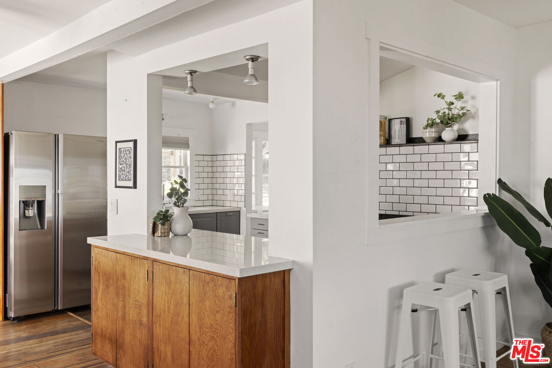 10536 Pinewood Avenue Tujunga, CA 91042 - Photo 12 of 33 a bathroom with a sink and a mirror
