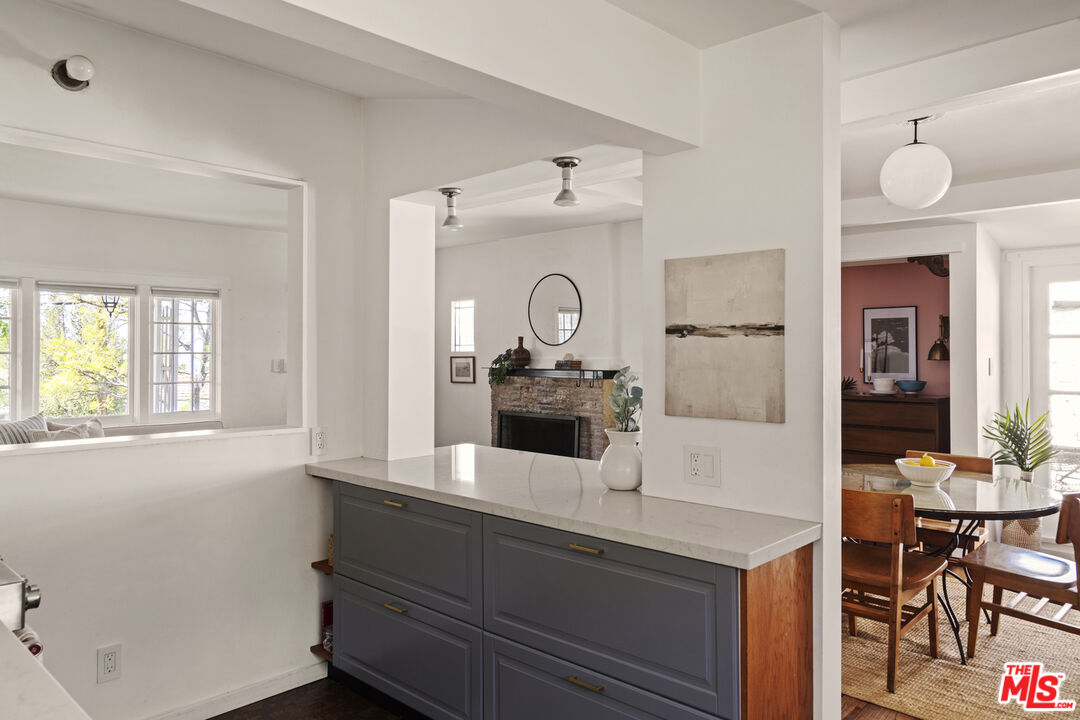 10536 Pinewood Avenue Tujunga, CA 91042 - Photo 16 of 33 a view of living room with granite countertop furniture and wooden floor