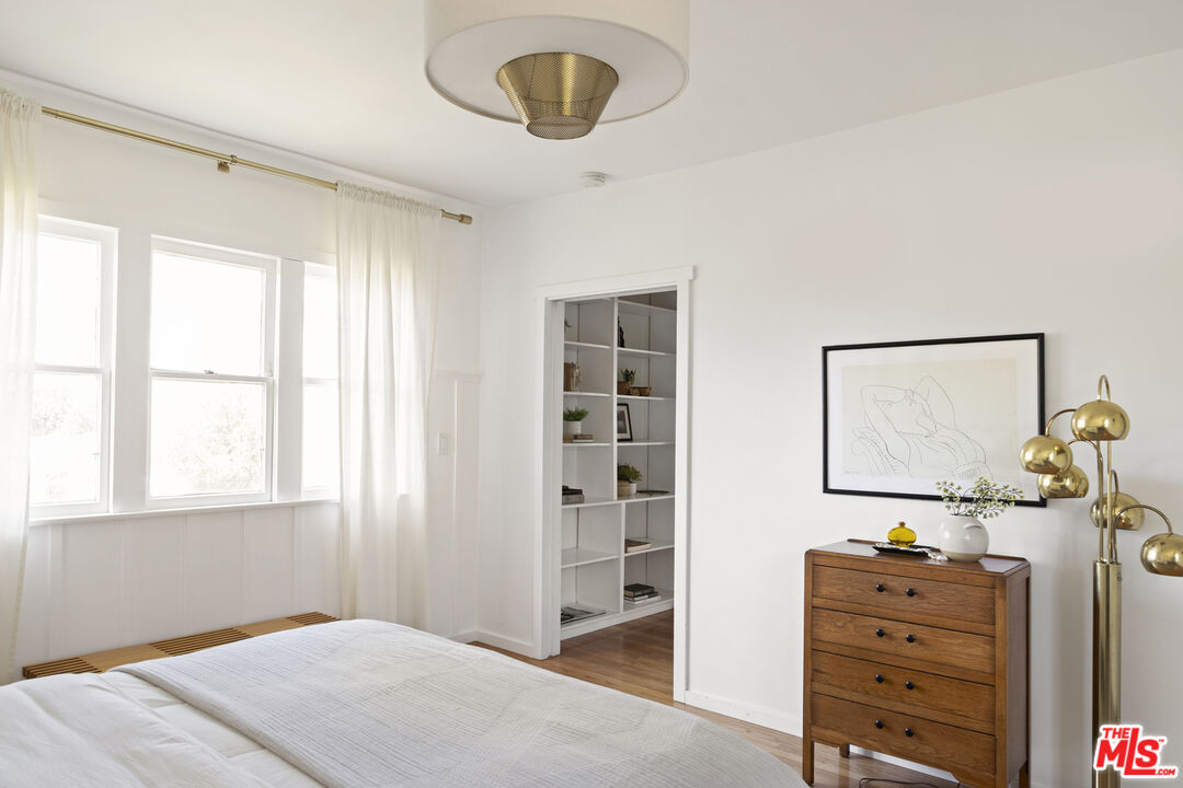 10536 Pinewood Avenue Tujunga, CA 91042 - Photo 18 of 33 a bedroom with a bed and a window