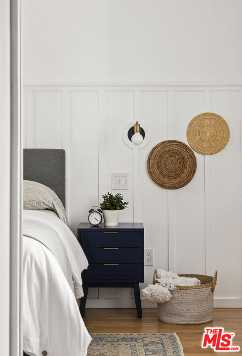 10536 Pinewood Avenue Tujunga, CA 91042 - Photo 19 of 33 a bedroom with a bed and cabinets