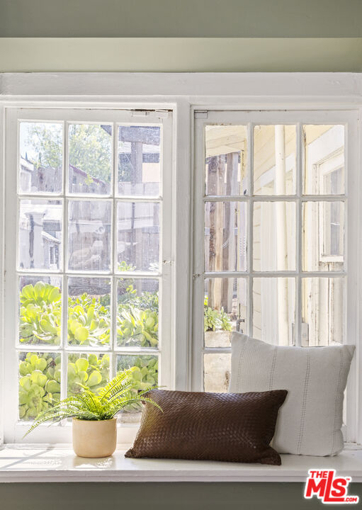 10536 Pinewood Avenue Tujunga, CA 91042 - Photo 21 of 33 a living room with furniture and a window