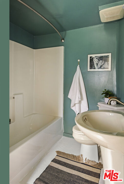 10536 Pinewood Avenue Tujunga, CA 91042 - Photo 23 of 33 a bathroom with a sink and mirror