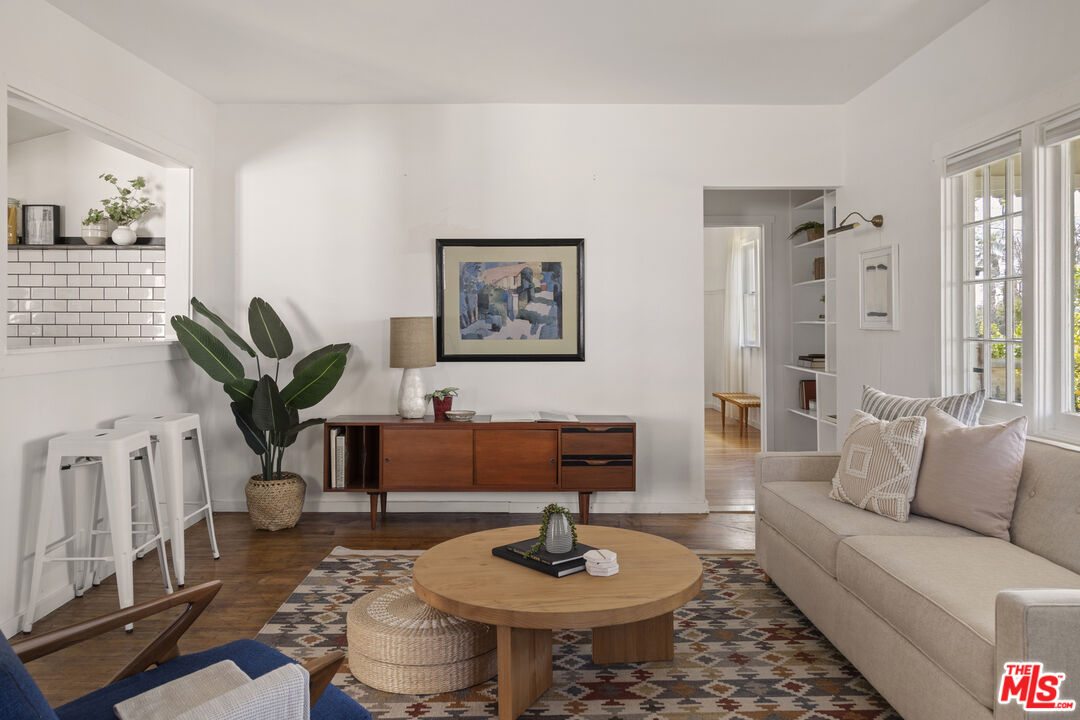 10536 Pinewood Avenue Tujunga, CA 91042 - Photo 6 of 33 a living room with furniture and a wooden floor