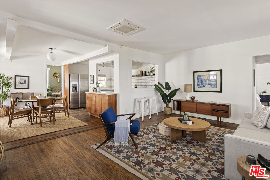 10536 Pinewood Avenue Tujunga, CA 91042 - Photo 7 of 33 a living room with furniture and wooden floor