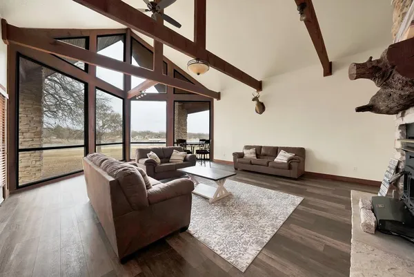 a living room with furniture or couch and a floor to ceiling window