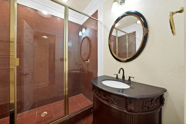 a bathroom with a sink a toilet and a mirror