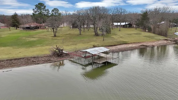 a view of a lake with a yard