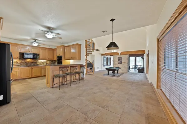 a view of a kitchen with furniture and a window