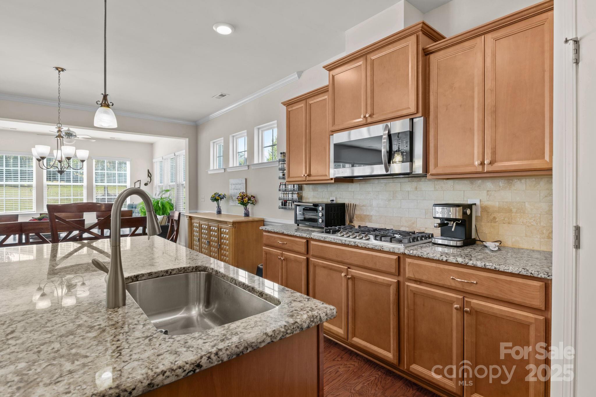 15925 Foreleigh Road Huntersville, NC 28078 - Photo 14 of 48 a kitchen with stainless steel appliances granite countertop a sink a stove and cabinets