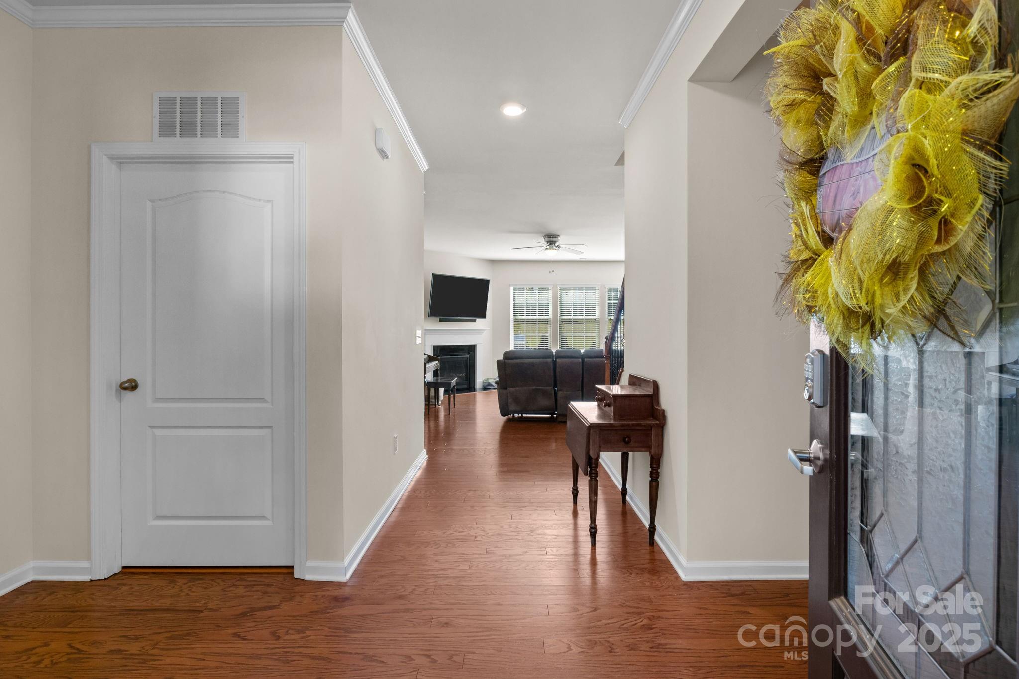 15925 Foreleigh Road Huntersville, NC 28078 - Photo 21 of 48 a view of a hallway with wooden floor and a living room