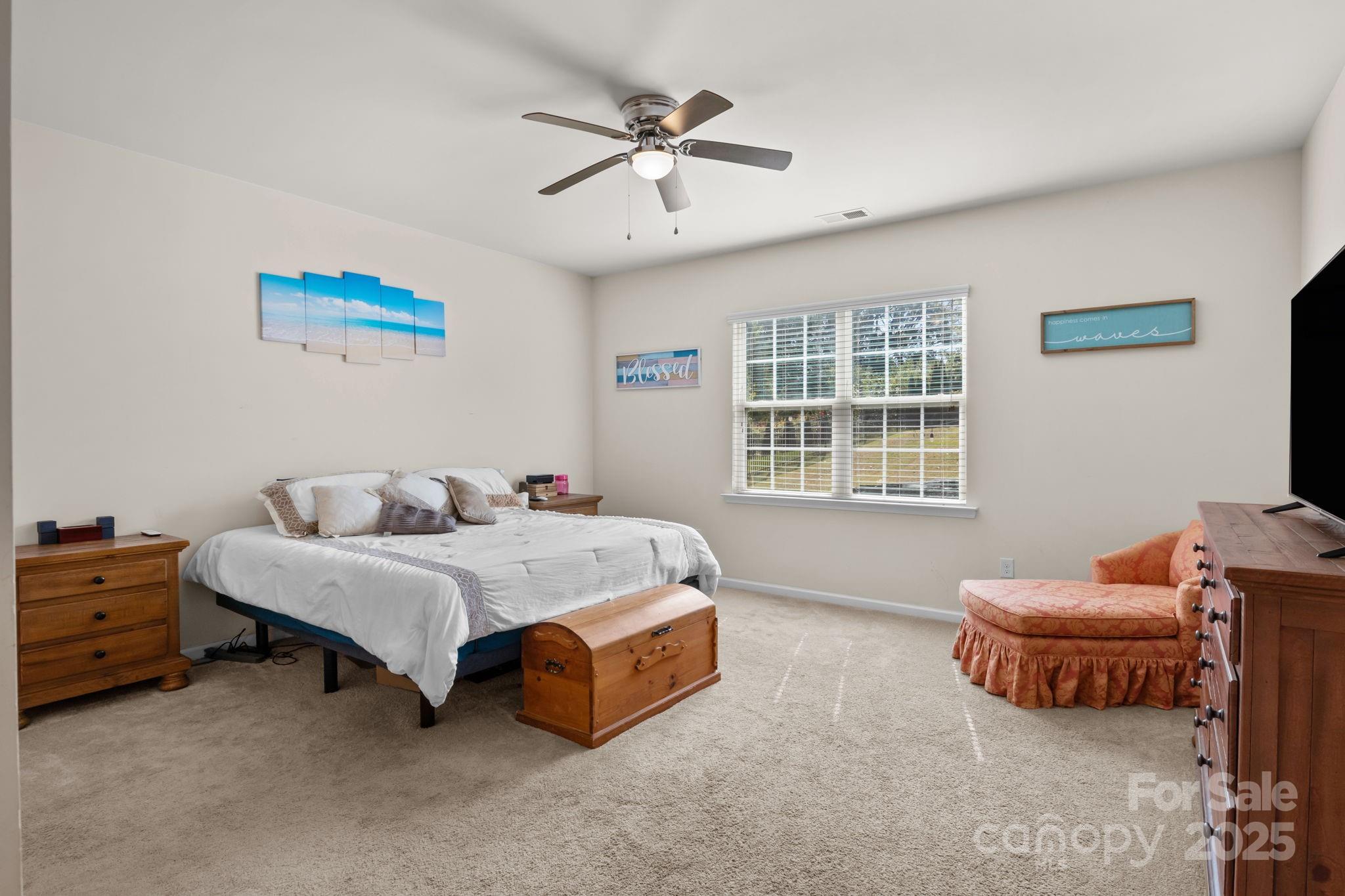 15925 Foreleigh Road Huntersville, NC 28078 - Photo 22 of 48 a spacious bedroom with a bed and a window