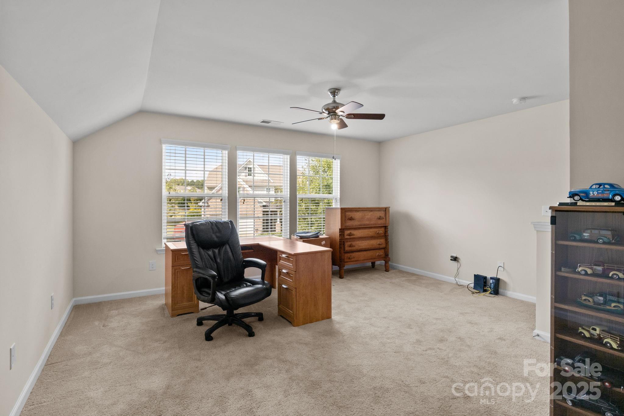 15925 Foreleigh Road Huntersville, NC 28078 - Photo 28 of 48 a view of a workspace with furniture and a window