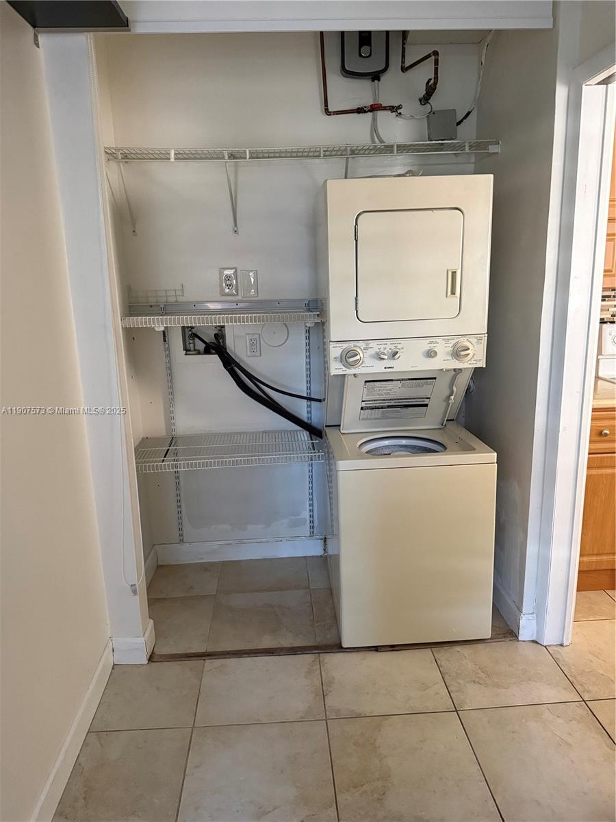 18308 Northwest 68th Avenue, Unit F Hialeah, FL 33015 - Photo 13 of 17 a utility room with dryer and washer