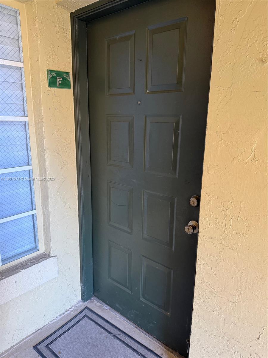 18308 Northwest 68th Avenue, Unit F Hialeah, FL 33015 - Photo 3 of 17 a view of front door