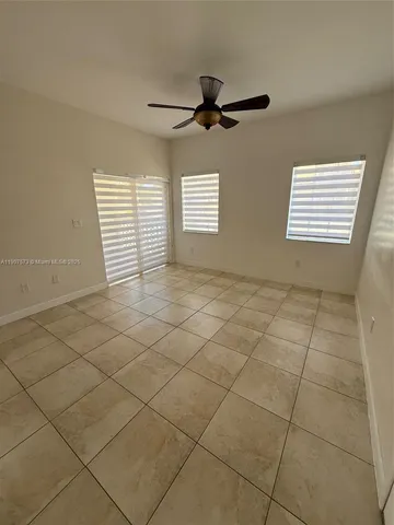 a view of an empty room and a window