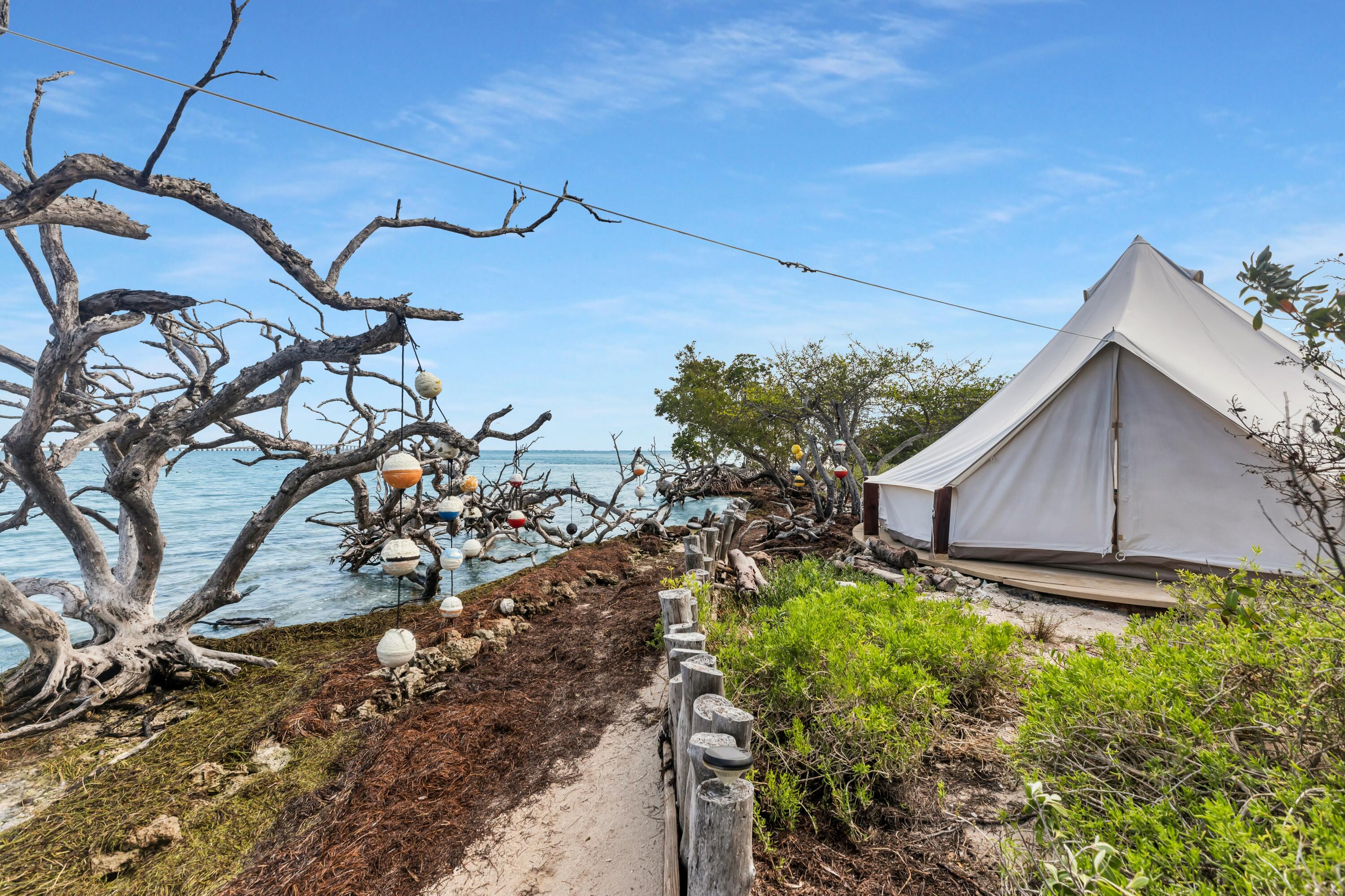 Molasses Keys Marathon, FL 33050 - Photo 26 of 36 a backyard of a house with lots of green space