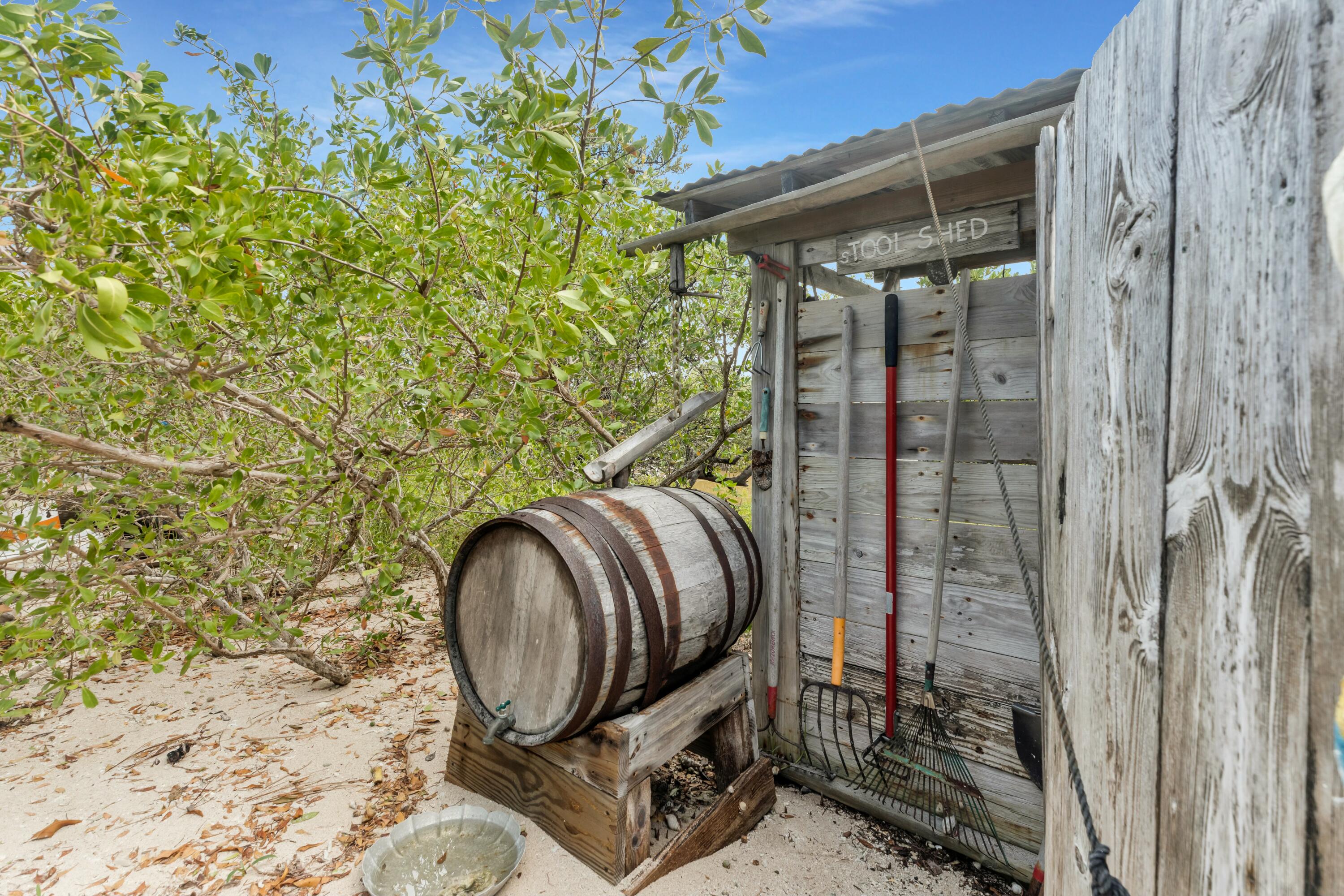 Molasses Keys Marathon, FL 33050 - Photo 34 of 36 a backyard of a house with barbeque oven and glass windows