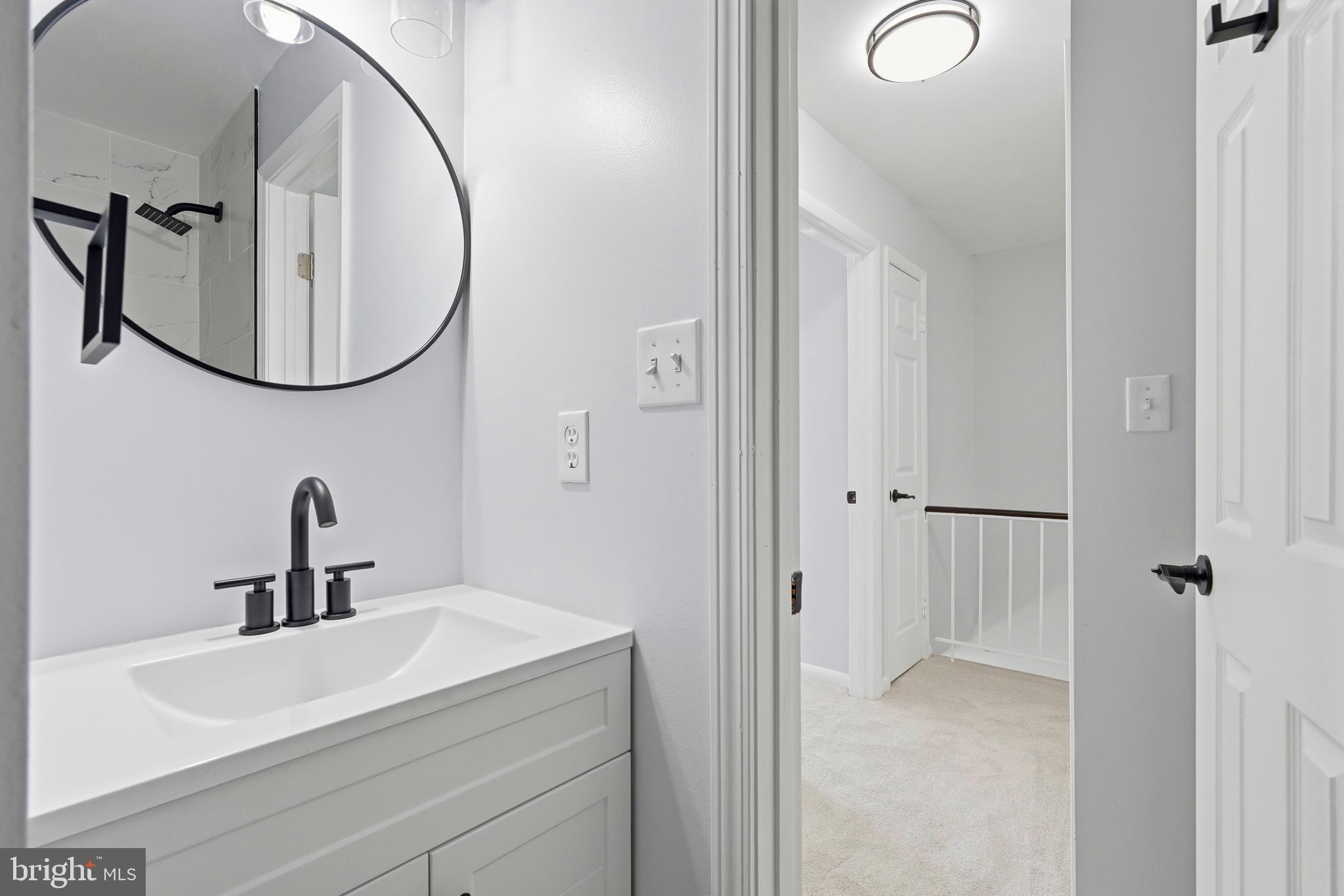 3682 Masthead Trail Triangle, VA 22172 - Photo 42 of 53 a bathroom with a sink and a mirror