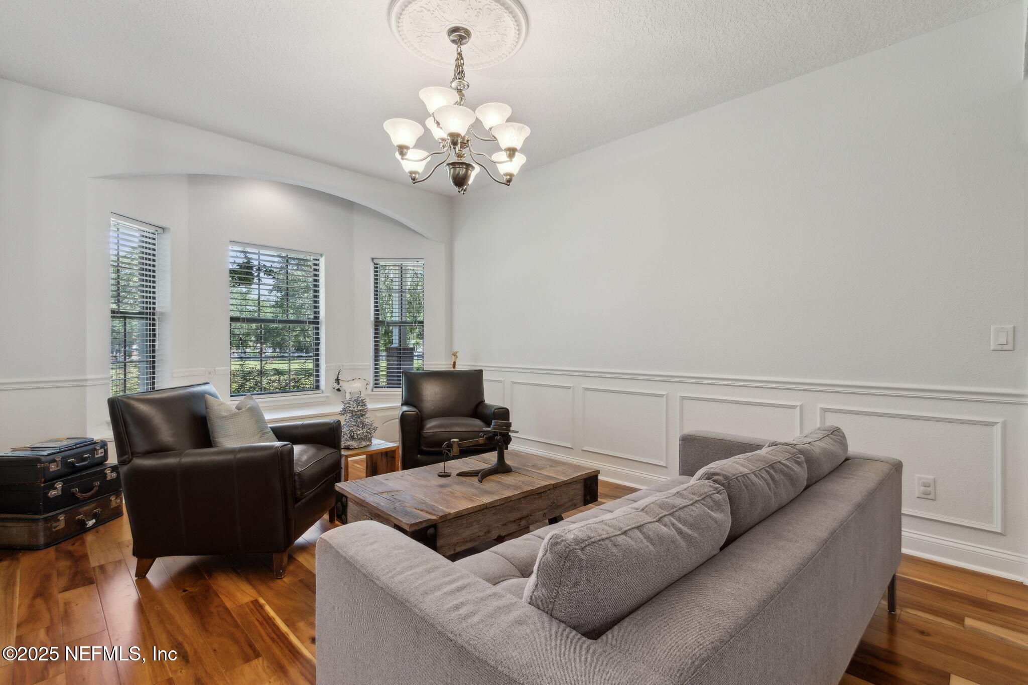87377 Raddin Road Yulee, FL 32097 - Photo 18 of 75 a living room with furniture and a large window