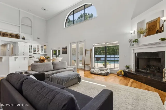 a bathroom with a granite countertop sink a mirror and a shower