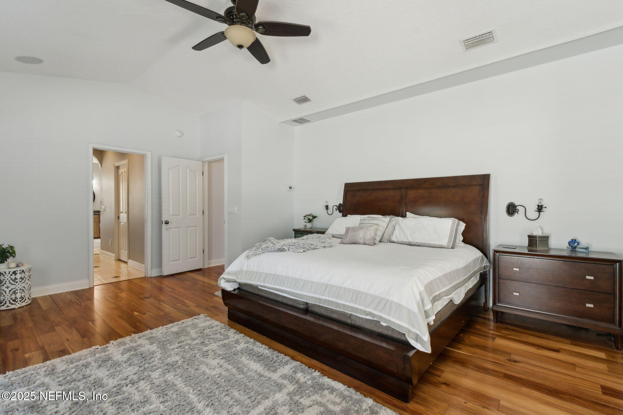 87377 Raddin Road Yulee, FL 32097 - Photo 39 of 75 a bedroom with a bed and dresser