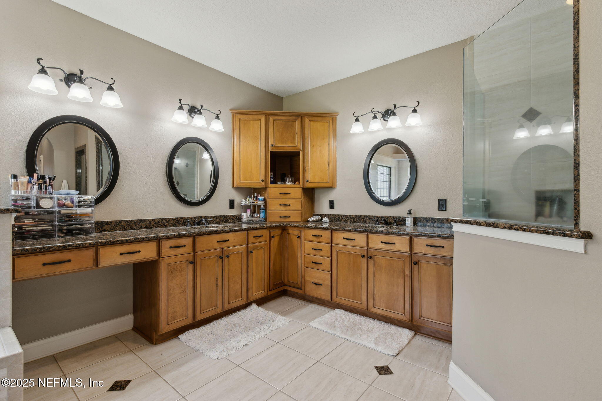 87377 Raddin Road Yulee, FL 32097 - Photo 40 of 75 a bathroom with a sink and a mirror