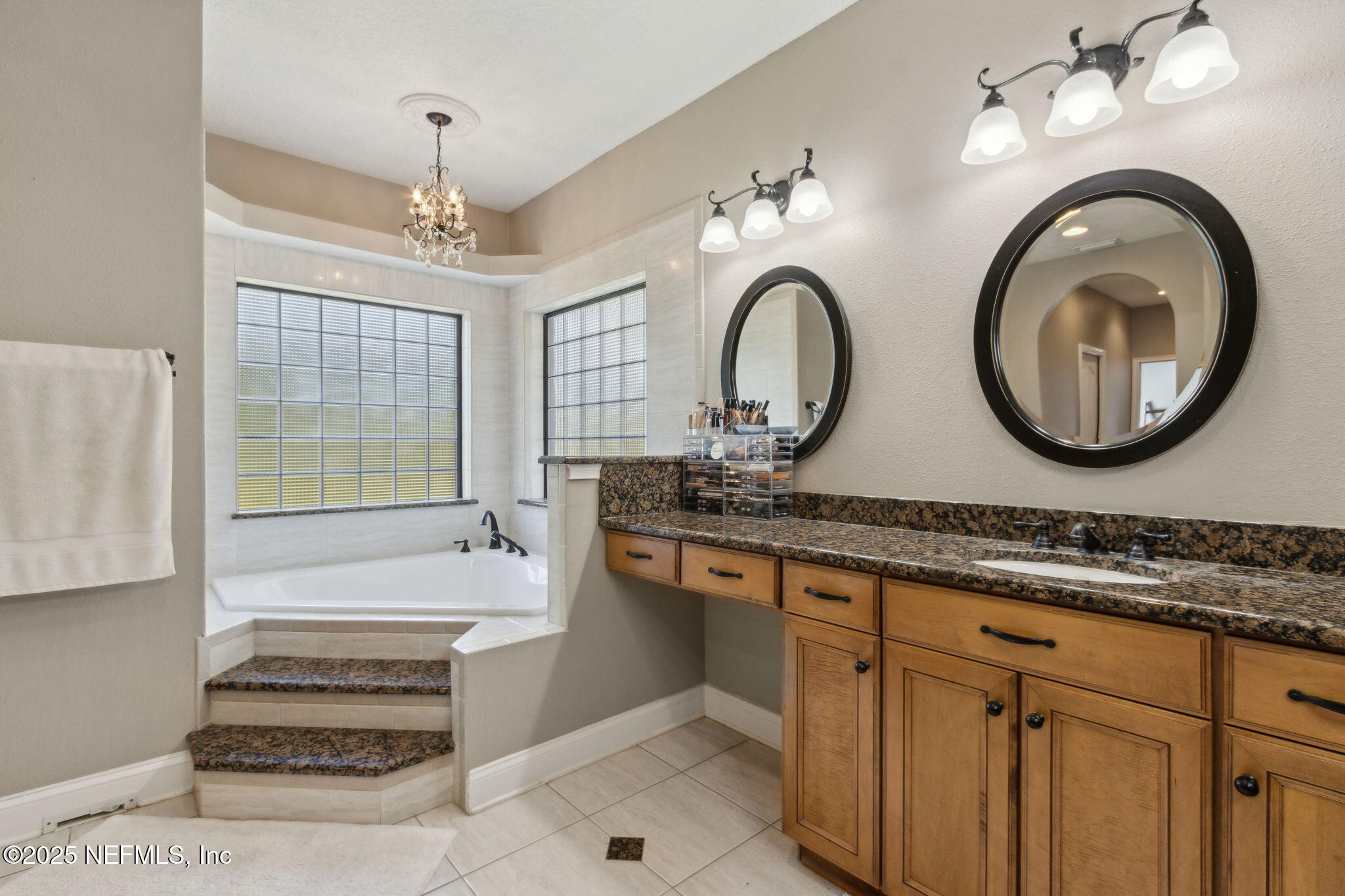 87377 Raddin Road Yulee, FL 32097 - Photo 42 of 75 a bathroom with a granite countertop double vanity sink and a mirror
