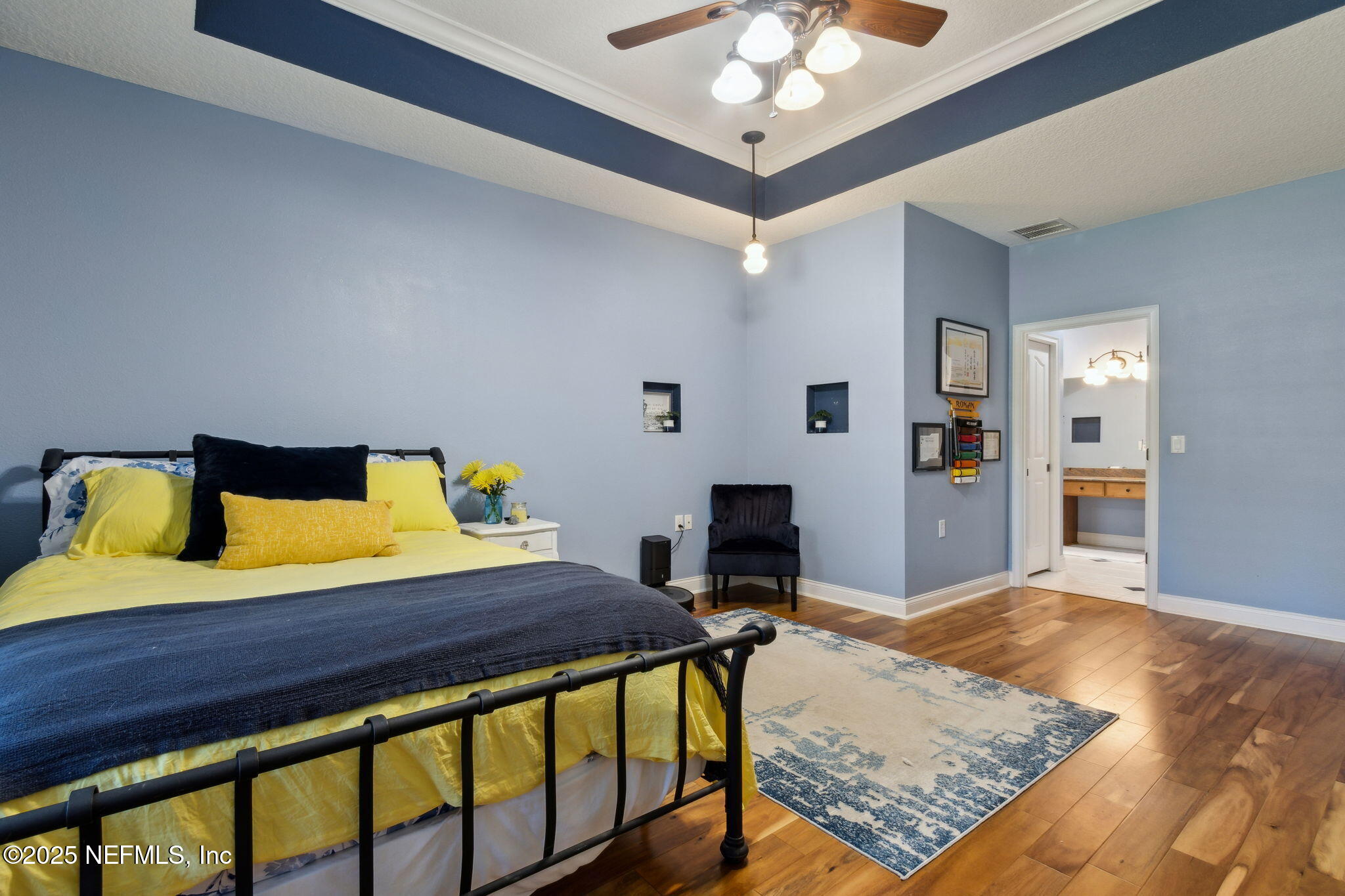 87377 Raddin Road Yulee, FL 32097 - Photo 45 of 75 a bedroom with a bed and a table in it