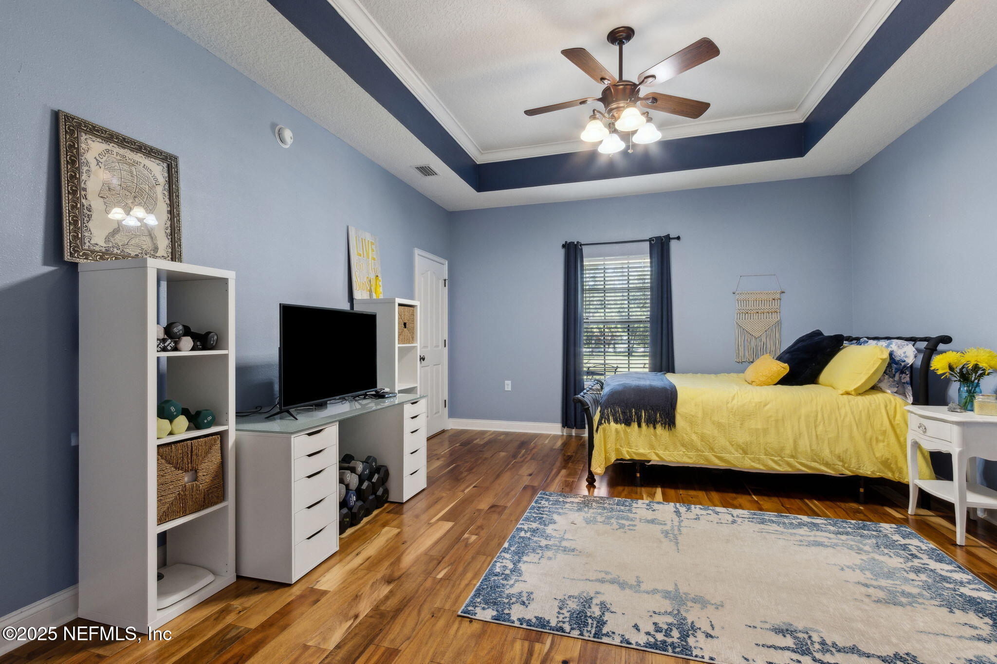87377 Raddin Road Yulee, FL 32097 - Photo 46 of 75 a bedroom with a bed and a flat screen tv