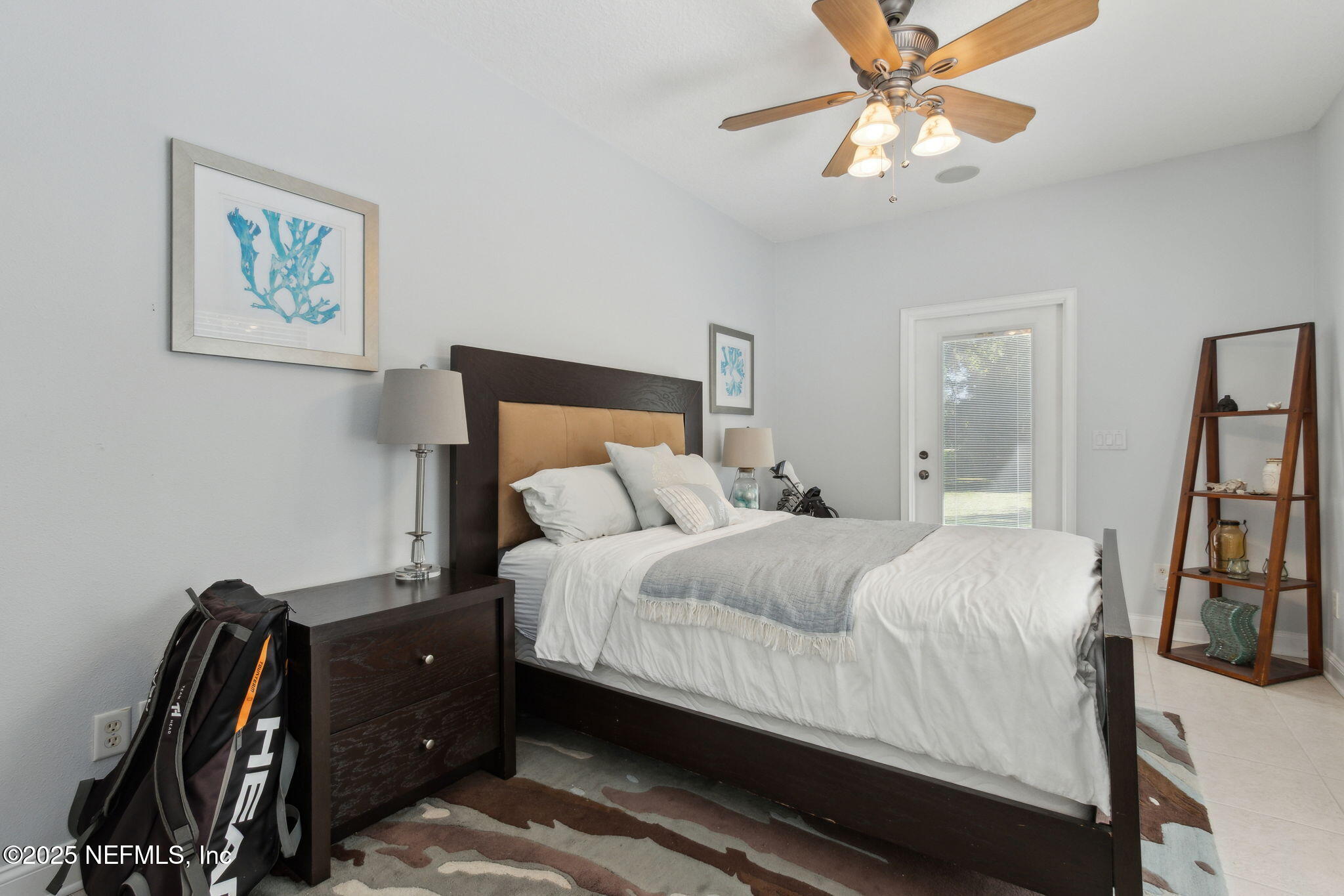 87377 Raddin Road Yulee, FL 32097 - Photo 48 of 75 a bedroom with a bed and a large mirror