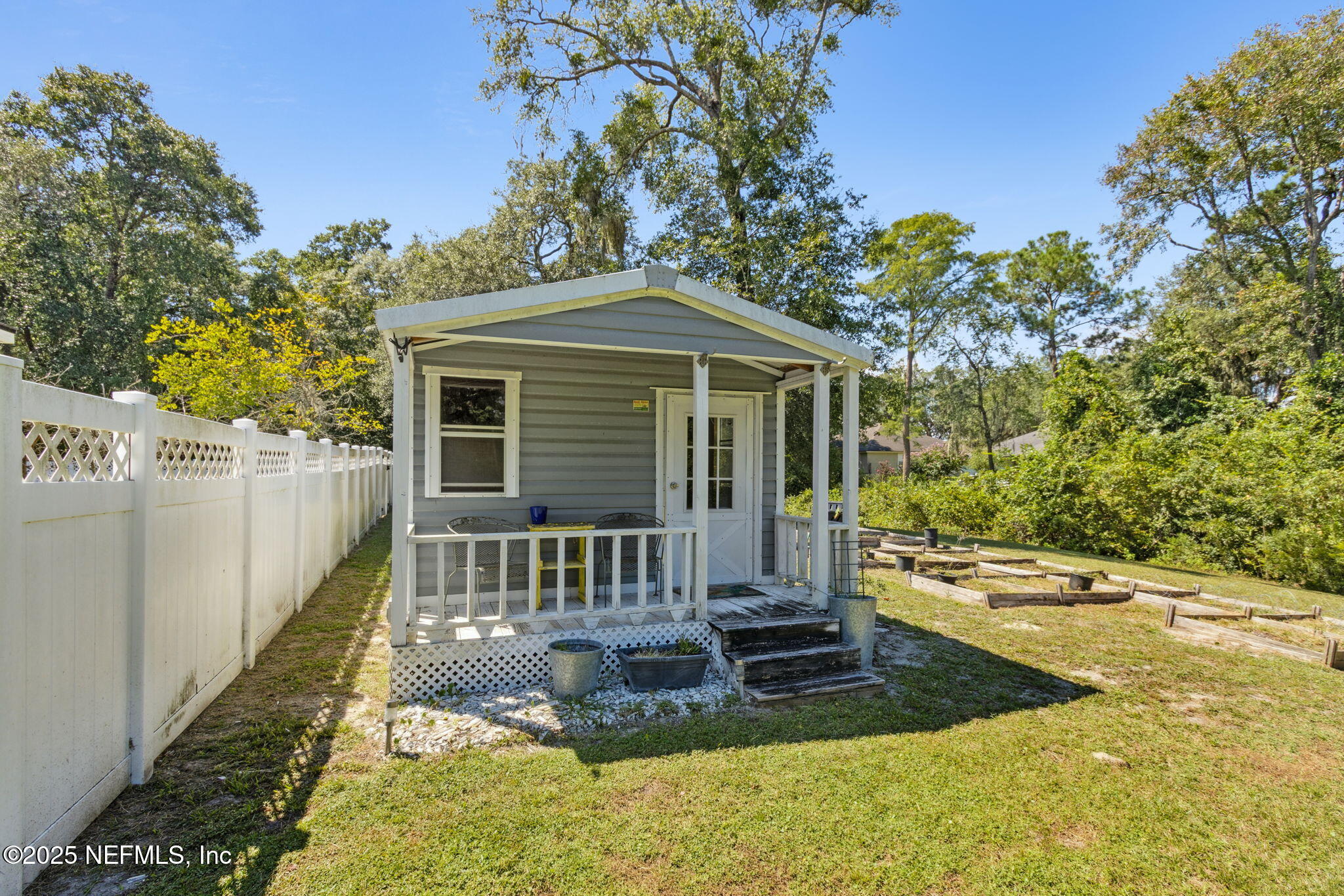 87377 Raddin Road Yulee, FL 32097 - Photo 68 of 75 a front view of a house with a yard
