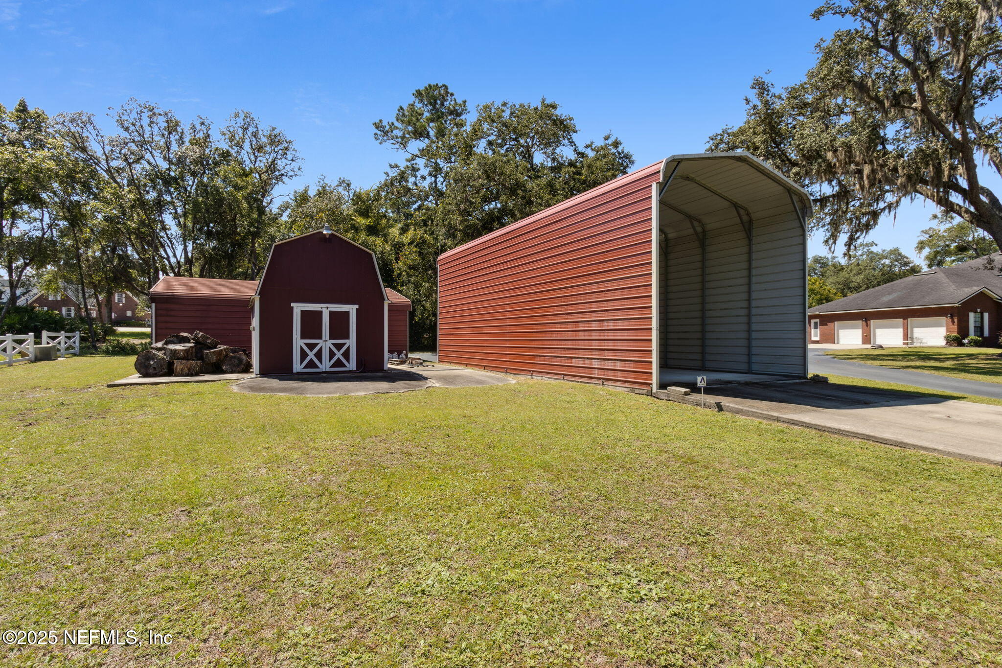87377 Raddin Road Yulee, FL 32097 - Photo 70 of 75 a front view of a house with yard and tree
