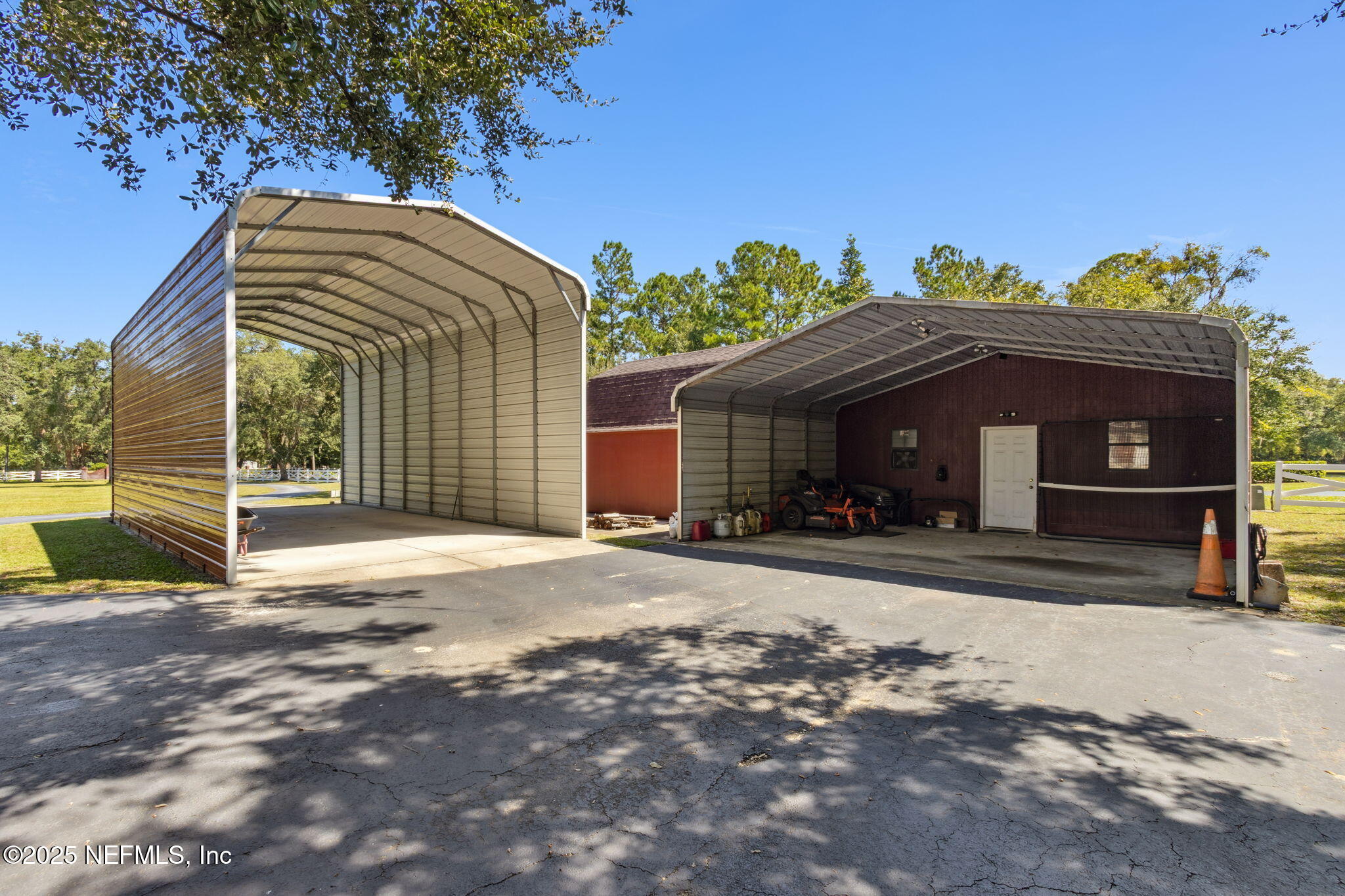 87377 Raddin Road Yulee, FL 32097 - Photo 71 of 75 a front view of a house with a yard and garage