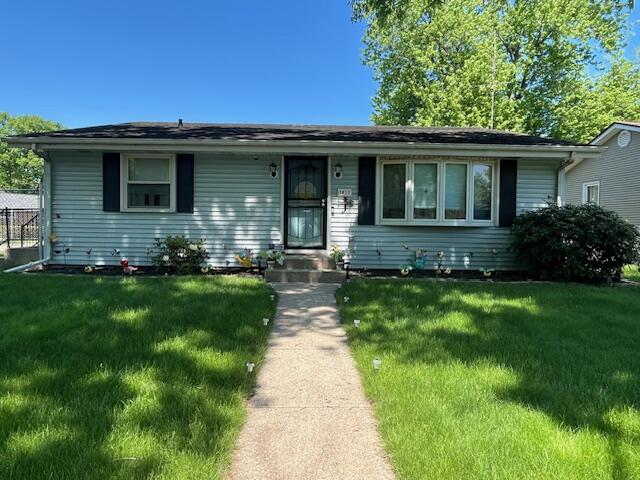 1417 Earl Road Michigan City, IN 46360 - Photo 1 of 25 a front view of house with yard and green space