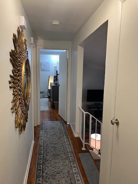1417 Earl Road Michigan City, IN 46360 - Photo 11 of 25 a view of a hallway with wooden floor and a living room