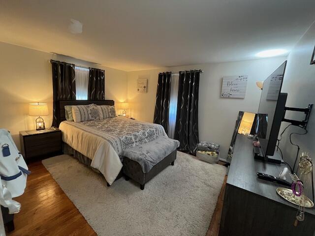 1417 Earl Road Michigan City, IN 46360 - Photo 15 of 25 a bedroom with a bed flat screen tv and window