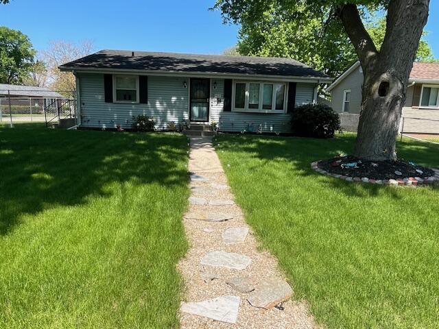 1417 Earl Road Michigan City, IN 46360 - Photo 2 of 25 a front view of a house with a yard and trees