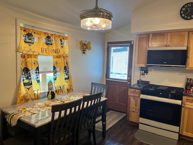1417 Earl Road Michigan City, IN 46360 - Photo 9 of 25 a kitchen with a table chairs and a stove