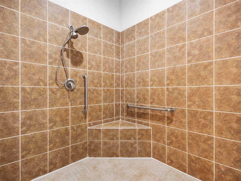 6990 Pin Oak Road Big Sandy, TX 75755 - Photo 14 of 40 a bathroom with a blue shower