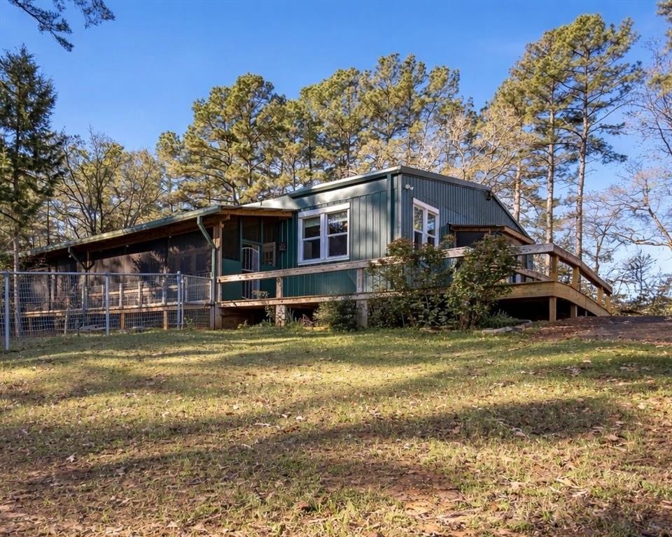 6990 Pin Oak Road Big Sandy, TX 75755 - Photo 2 of 40 a view of a house with a yard