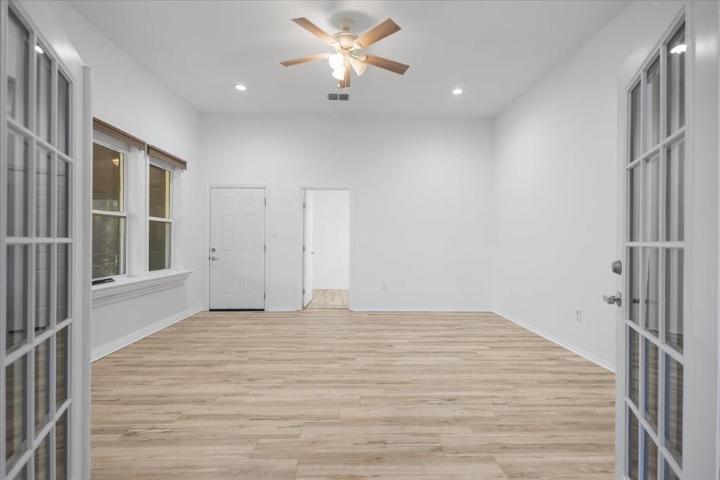 6990 Pin Oak Road Big Sandy, TX 75755 - Photo 22 of 40 a view of a livingroom with a ceiling fan and window