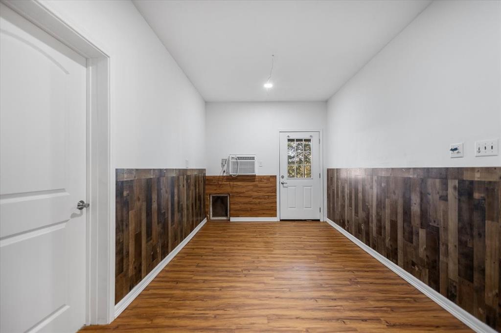 6990 Pin Oak Road Big Sandy, TX 75755 - Photo 30 of 40 a view of a hallway with wooden floor