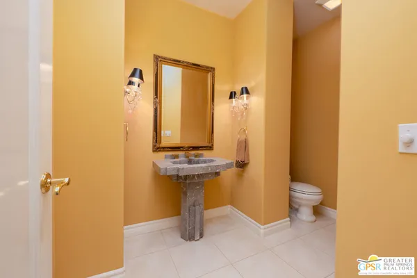 a spacious bathroom with a tub shower and sink