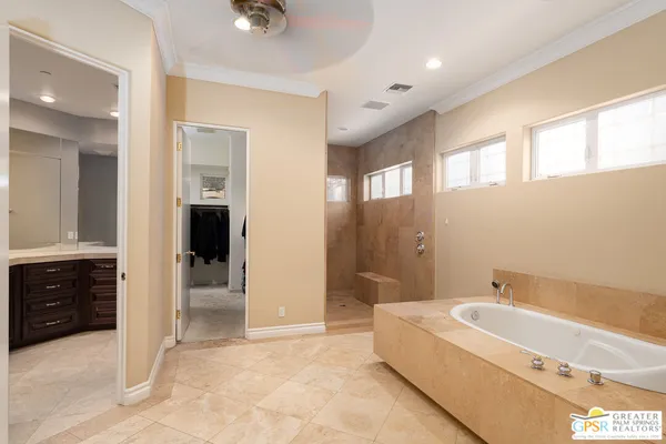 a kitchen with stainless steel appliances granite countertop a stove top oven a refrigerator a sink and dishwasher