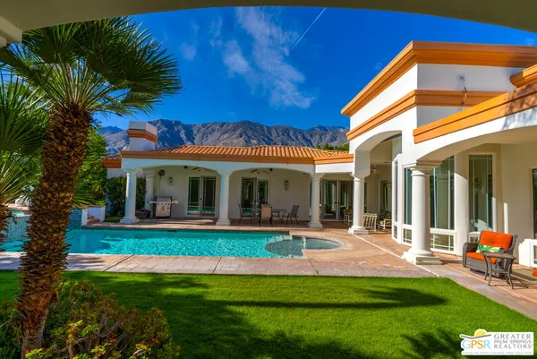 a view of a swimming pool with a patio