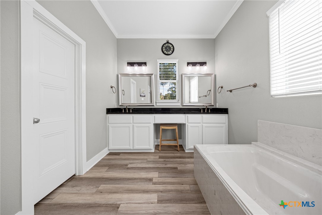 28099 Fm 2670 Killeen, TX 76549 - Photo 13 of 48 a spacious bathroom with a sink and a mirror