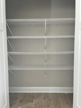 a view of a closet with white paint